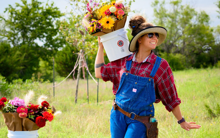 Woman holding a bucket happy.